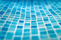 Vibrant abstract image of blue mosaic pattern creating a wave-like texture.