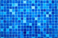 Close-up of a vibrant blue mosaic tile pattern, perfect for design and texture applications.